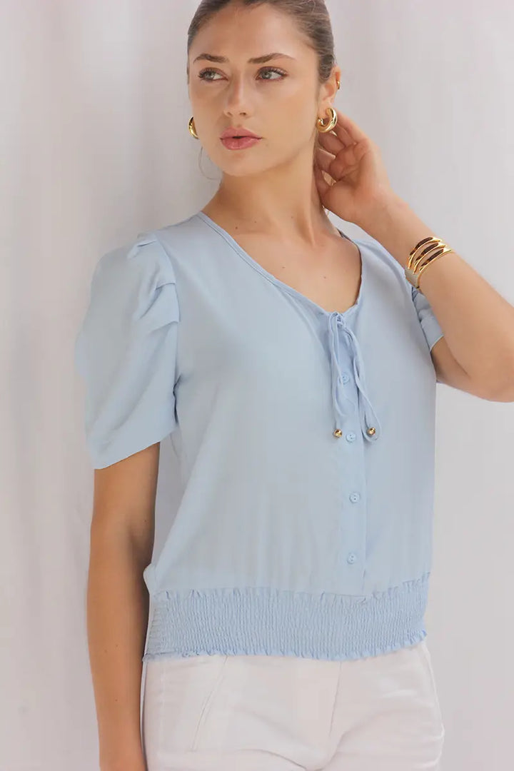 Blusa con pliegue en hombros